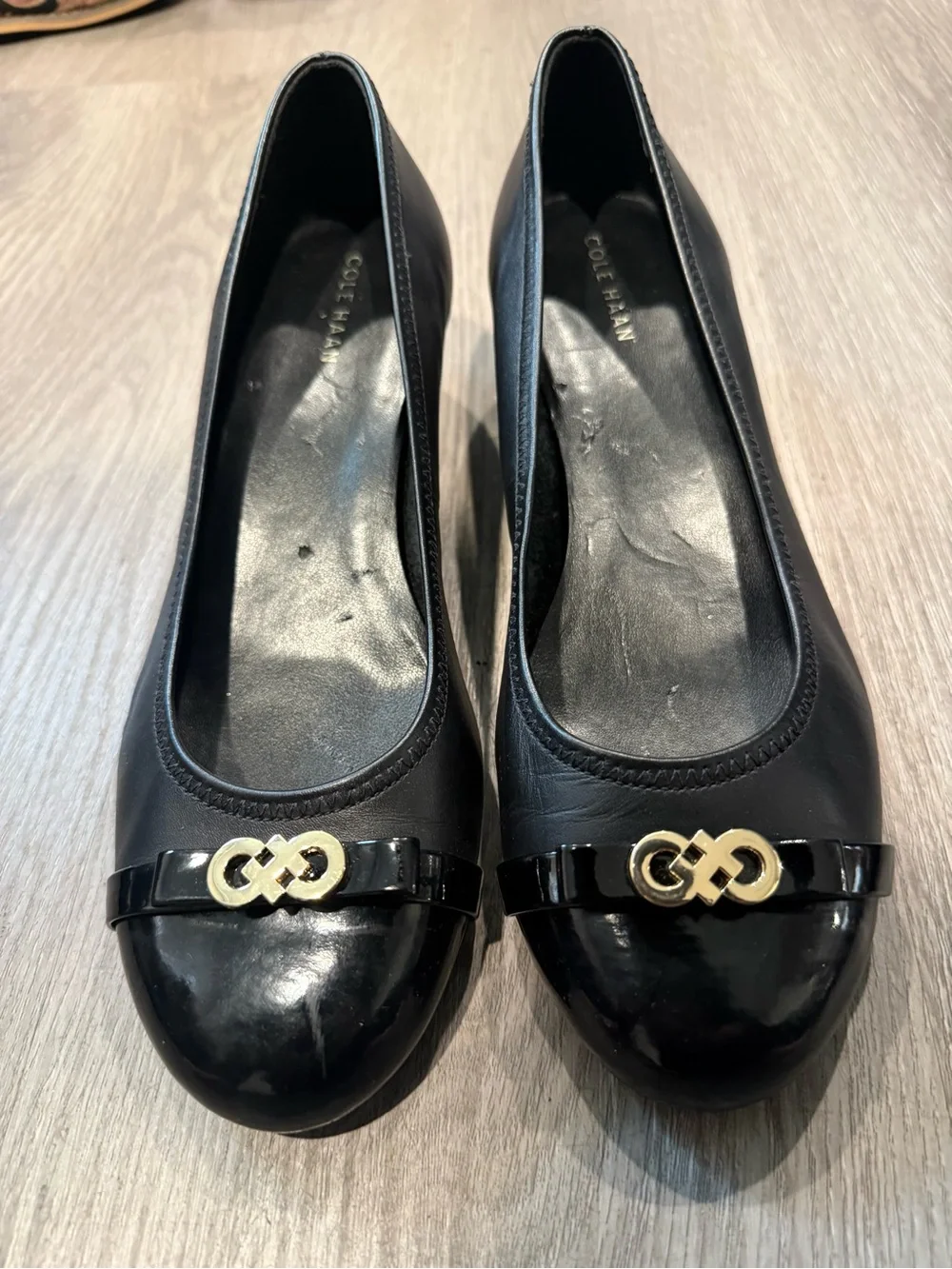 Cole Haan Black Leather Round-Toe Ballet Wedge Heels with Gold Logo Accent